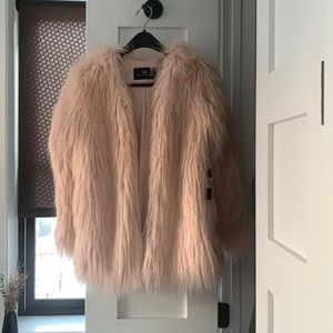 Tarts Collection never been used. XS. Light blush  faux fur.